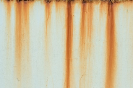 Rust removal on concrete what causes orange stains and how pros fix them